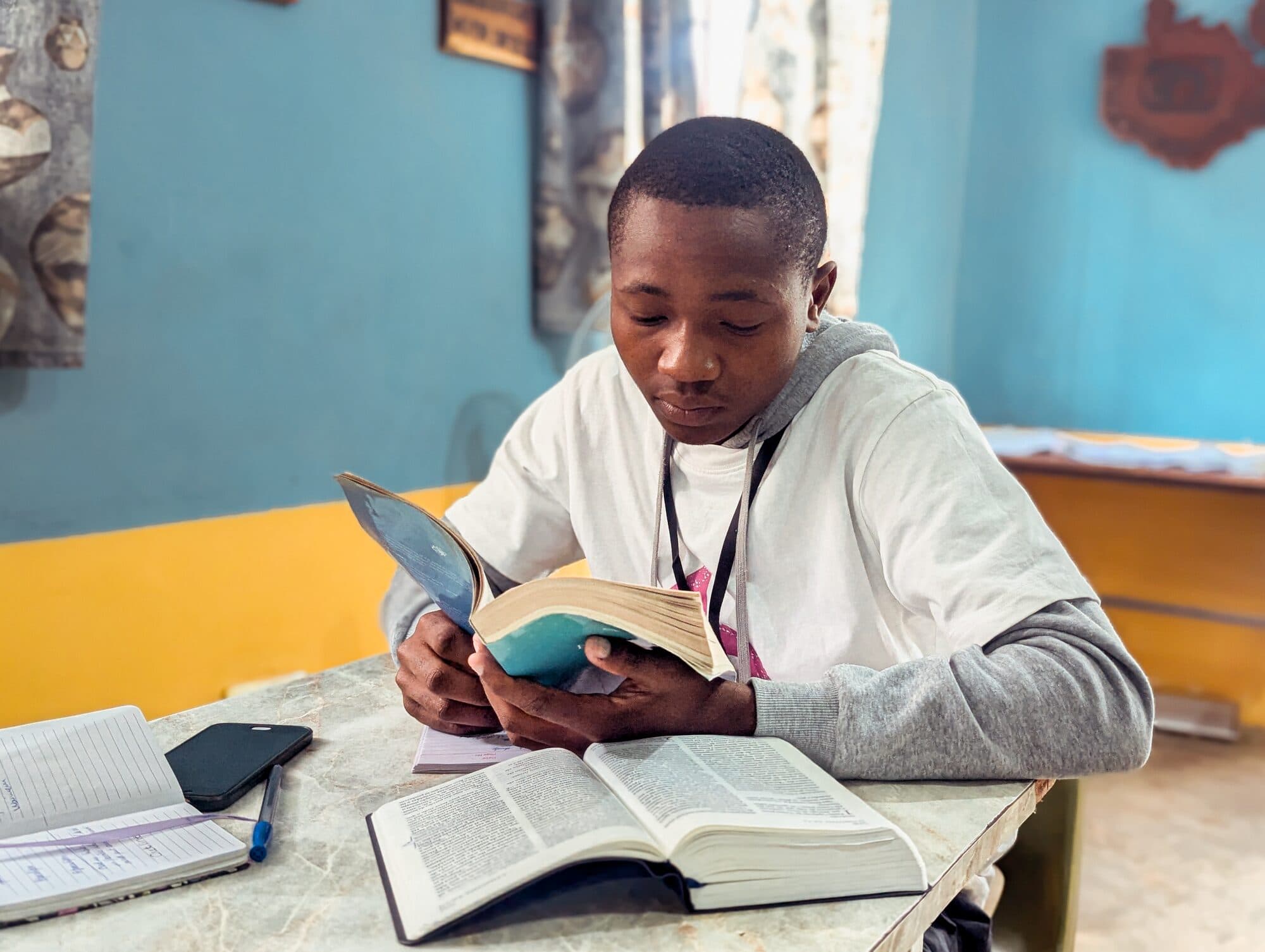 A YWAM Lusaka student reading and studying the Bible