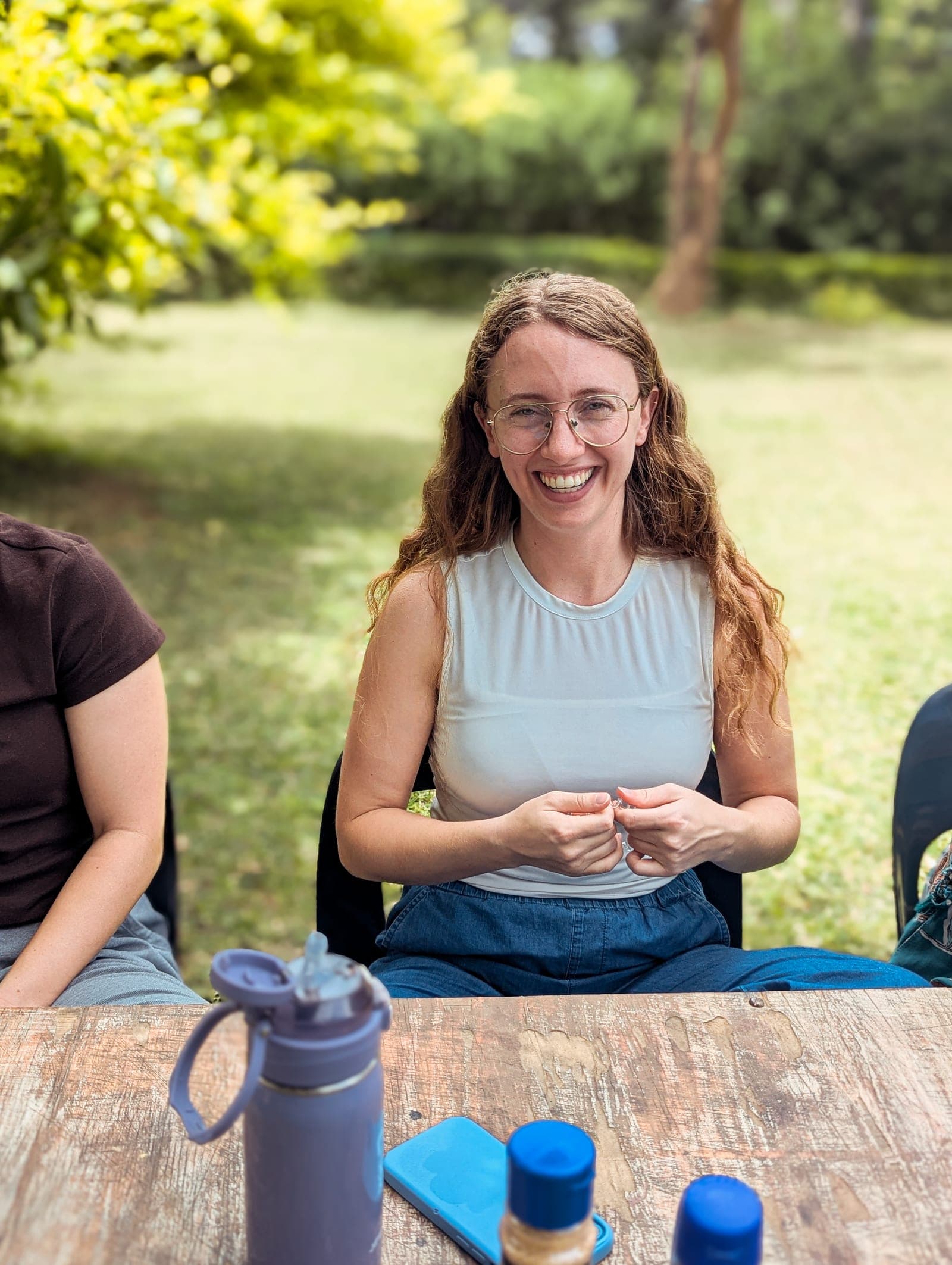 A member of the Birth Attendant School team laughing during time together at the base